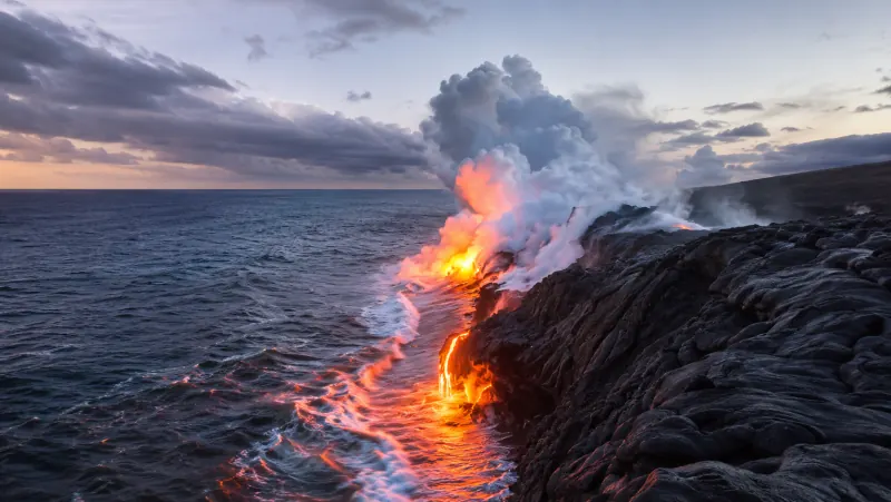 Lava entering the Pacific Ocean at dusk on Hawaiʻi Island